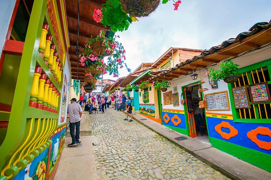From Guatape: Pablo Escobar Mansion, Paintball & Boat Ride - Traditional village stop: a 50-minute guided walk