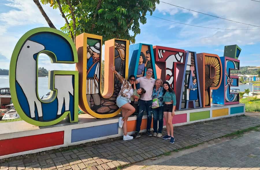 From Medellin: Guatapé & Peñol Rock with Boat & farm animals - Guatapé town walk: Umbrella Street, main square, and story-filled baseboards