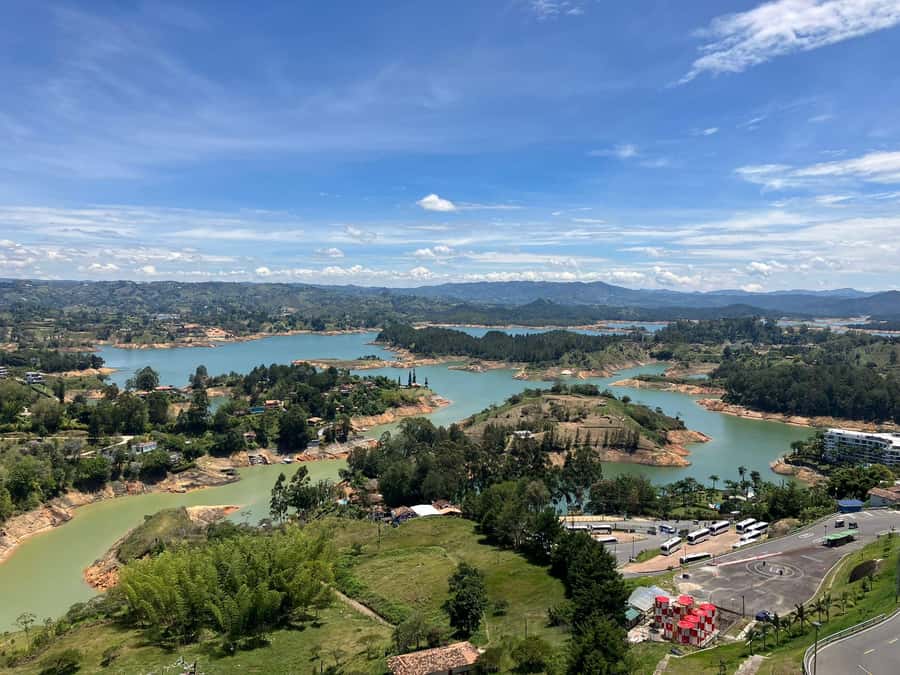 From Medellín: Guatape Private Tour, El Peñol, Boat Ride - Guatapé town: zócalos, shops, and guided context