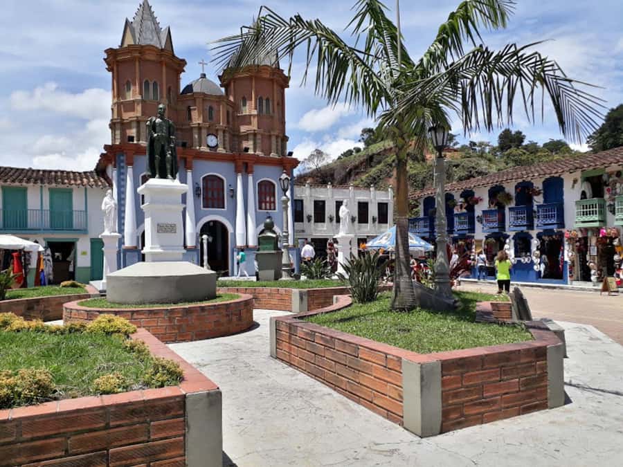 From Medellin: Private Guatape Car Tour with Coffee Tour - Walking Guatapé Town: Cathedral Square, Plazotela, and Story Stops