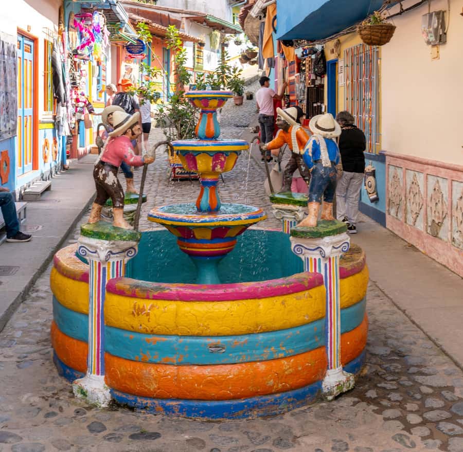 Guatapé Tour by Chiva + Visit to Pablo Escobar's Hacienda - Guatapé town: umbrellas, color, and your best photo window