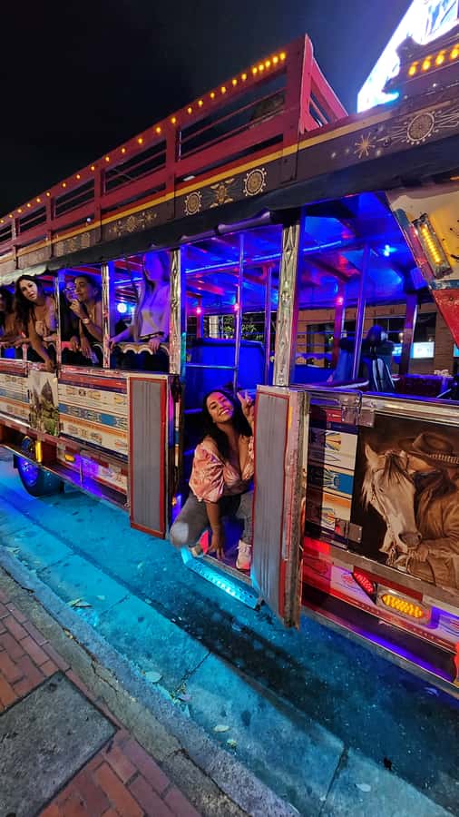 Medellin: Party Bus with DJ & Street Food Tastings - Meeting in El Poblado: Where the Night Starts