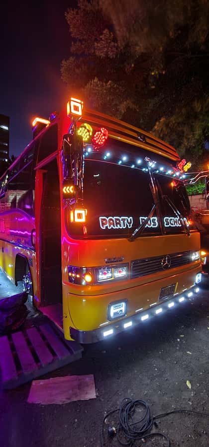 Medellin: Rumbero Party Bus with all the beer you can drink - Milla de Oro Avenue: Hotels, Shopping, and Night Views